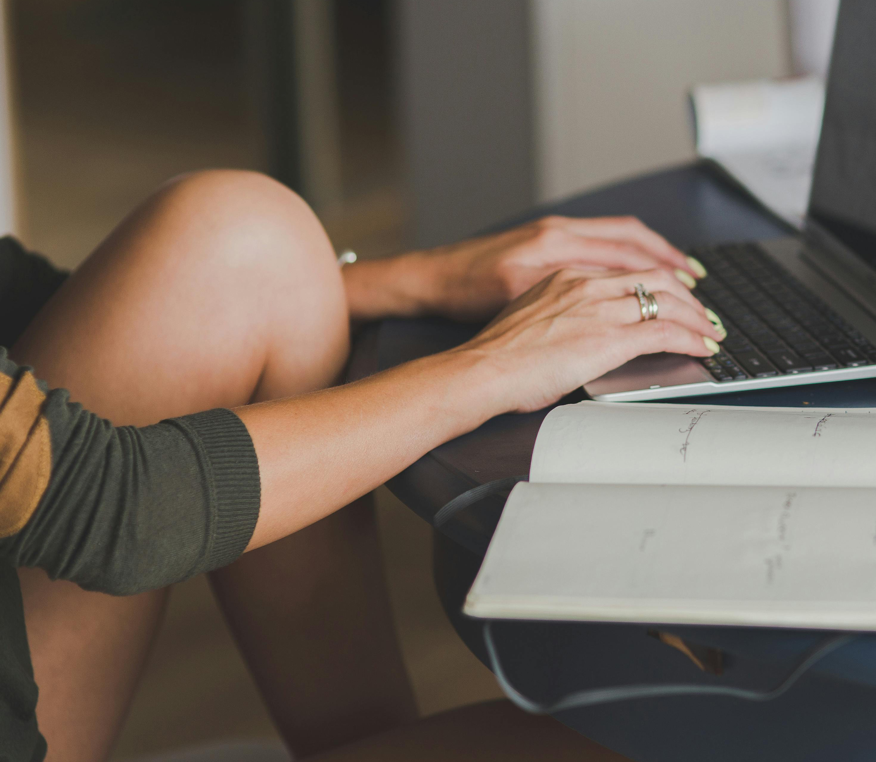 Woman at table with laptop